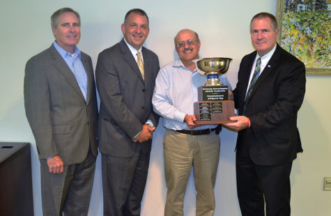 Photo courtesy of Kevin Taylor, Point Park Athletics.Point Park University administrators were presented the KIAC Commissioner’s Cup by conference commissioner Scott McClure (far right). Pictured (L to R) are President, Dr. Paul Hennigan, Vice President of Student Affairs and Dean of Students, Keith Paylo, and Director of Athletics, Dan Swalga. 