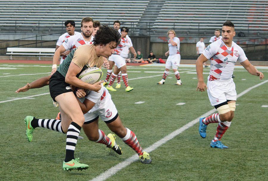 Sophomore flanker, Elliott Carr, tries to push forward against CMU on Saturday. Point Park lost the match, 35-5.