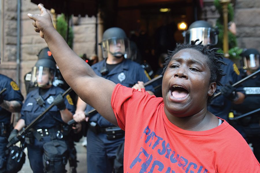 Fast food worker, Laquania Coleman, protests against Donald Trump on Thursday afternoon. She was in support of Black Lives Matter and the movement to stop police brutality against African American males.