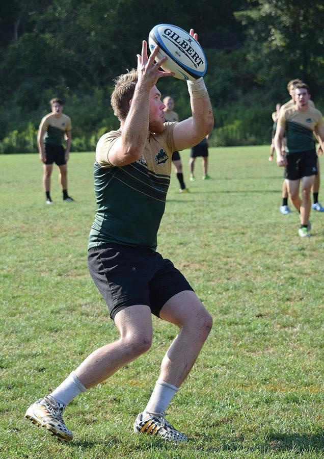 Senior 8 man, Brady Winner, catches the ball from another team member.