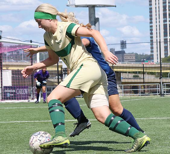 Senior forward Erin Gilmartin fights to keep the ball from the defender in order to get a shot on goal. Point Park lost to Spring Arbor, 4-0.