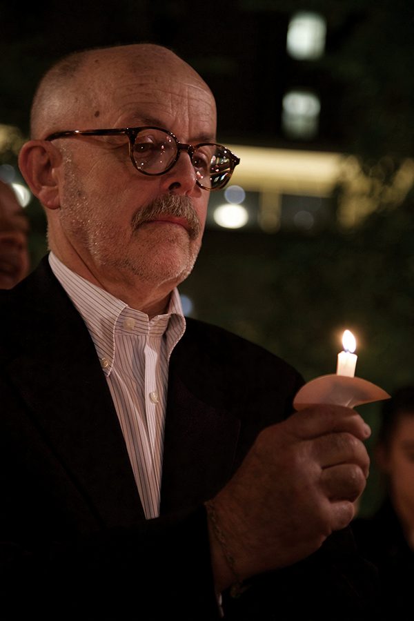 Associated Press photographer Richard Drew, who captured the famous “Falling Man” photo during the Sept. 11, 2001 terror attacks, joins Point Park students in a vigil on Sept. 15. Drew spoke to students beforehand and participated in the vigil, organized by the Honors Program.