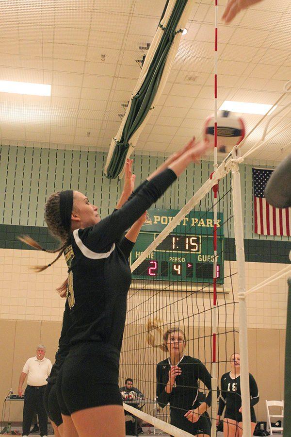 Sophomore middle hitter, Ashley Taylor, makes a jump to keep the ball over the net to help score against Rio Grande on September 27. Point Park won, 3-1.