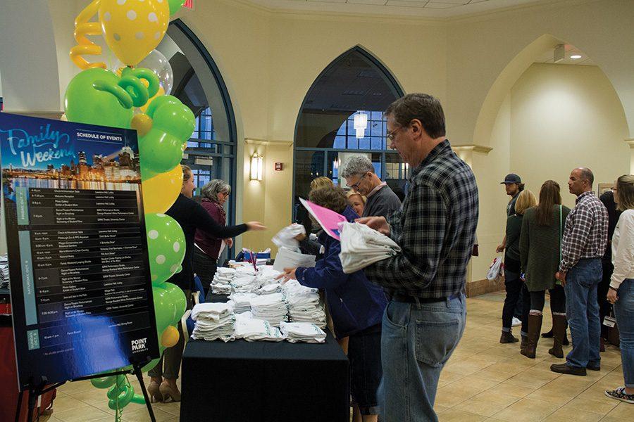 Families checking in at the registration table in the Lawrence Hall Lobby on Saturday as part of Point Park Family Weekend.