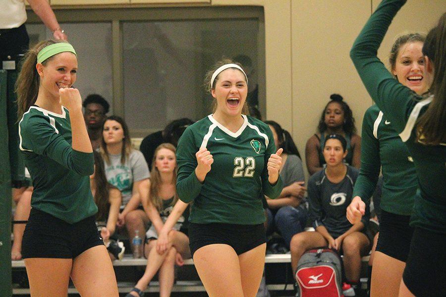 Sophomore middle hitter, Ashley Taylor, and freshman setter, Julia Menosky, celebrate with the team after scoring against Sienna Heights Sept. 2. Point Park’s volleyball team recently secured an automatic bid to the NAIA National Tournament. For coverage, turn to page 8.