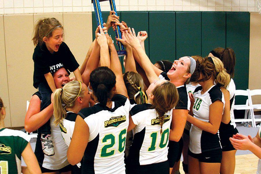 Point Park volleyball celebrates with their trophy after the AMC Title Game in November 2011. The Pioneers defeated Daemen 3-1 to advance to their first NAIA National Tournament in program history.
