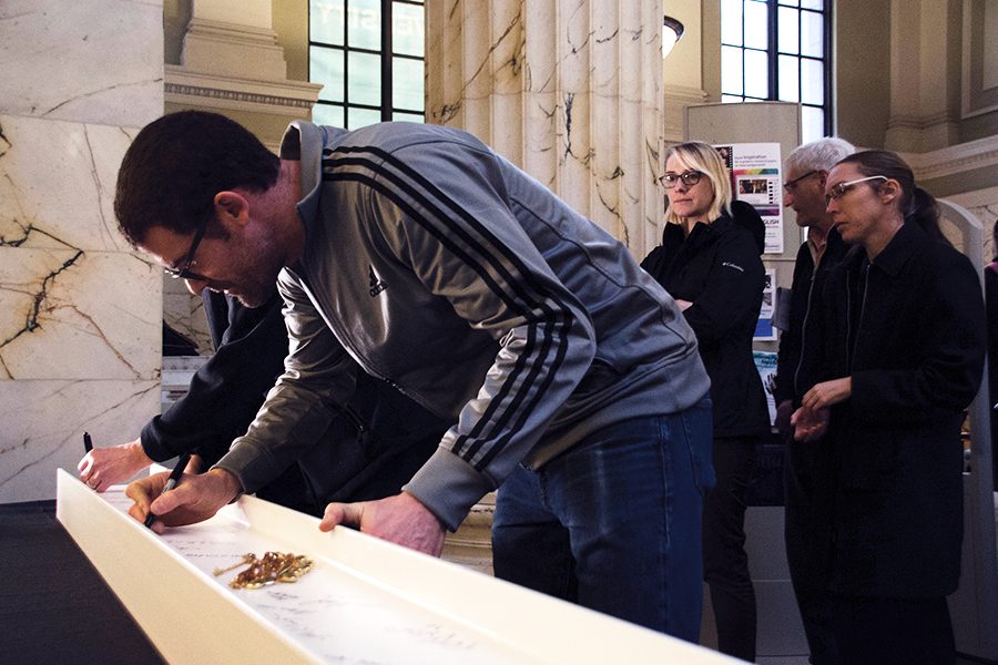 Students and faculty sign final beam for the Pittsburgh Playhouse, Wednesday Nov. 30. 