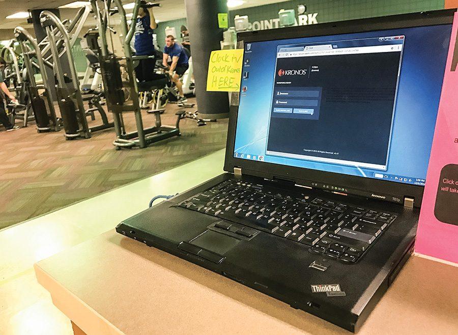 A laptop dedicated to the Kronos clock-in and clock-out system to track student work hours sits in the Student Center fitness center. Some student workers have had issues with the new software.