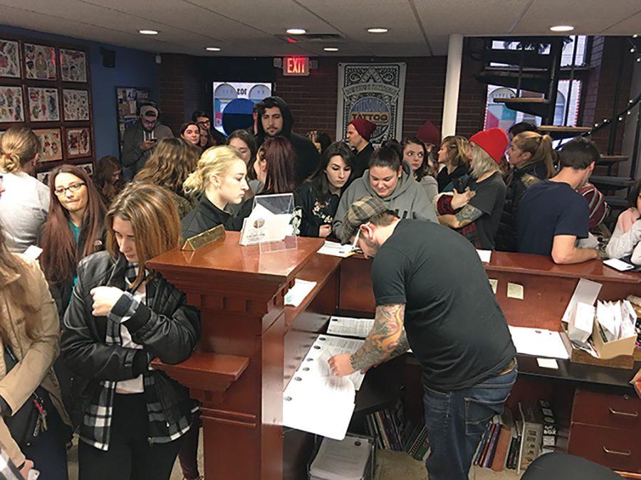 Students from Point Park, Duquesne and Pitt flood Pittsburgh Tattoo Company as they hold their annual Friday the 13th tattoo special. The special included $13 pre-drawn tattoos with a required $7 tip. Incoming customers was cut off around 4:30 p.m. by tattoo artist Susie Humphrey, who called it the “most successful special event they’ve had.”