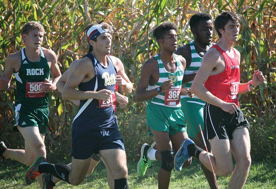 Dannys Marrero, freshman, runs between a few other competitors at the Lock Haven Invitational on September 24.
