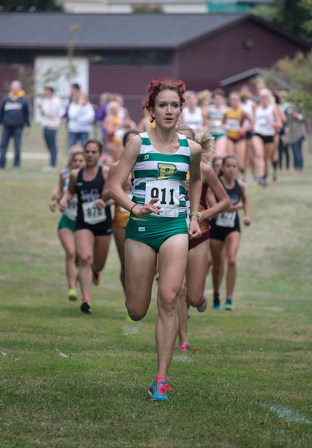 Junior Anna Shields runs ahead of the pack at Saturday’s Walsh Invitational in North Canton, Ohio. Shields won the women’s 5K race and broke her shared school record with a time of 17 minutes, 19 seconds. 