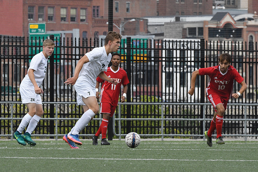 Wessel Rietveld, sophomore midfielder/defender, advances the ball down the field with freshman forward Mitchell Roell close behind.