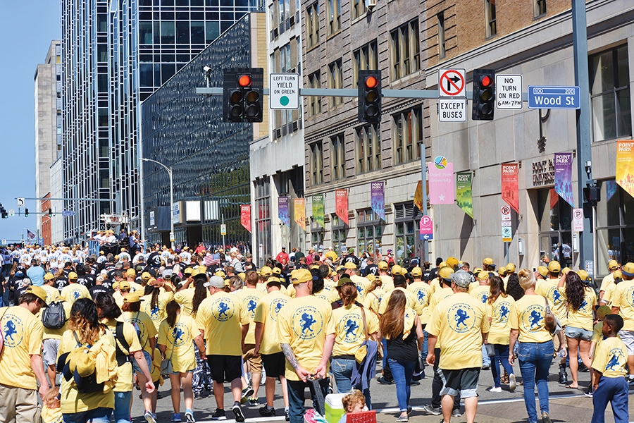 International Union of Painters and Allied Trades (IUPAT) march down the Boulevard of the Allies during the Labor Day Parade on Monday.