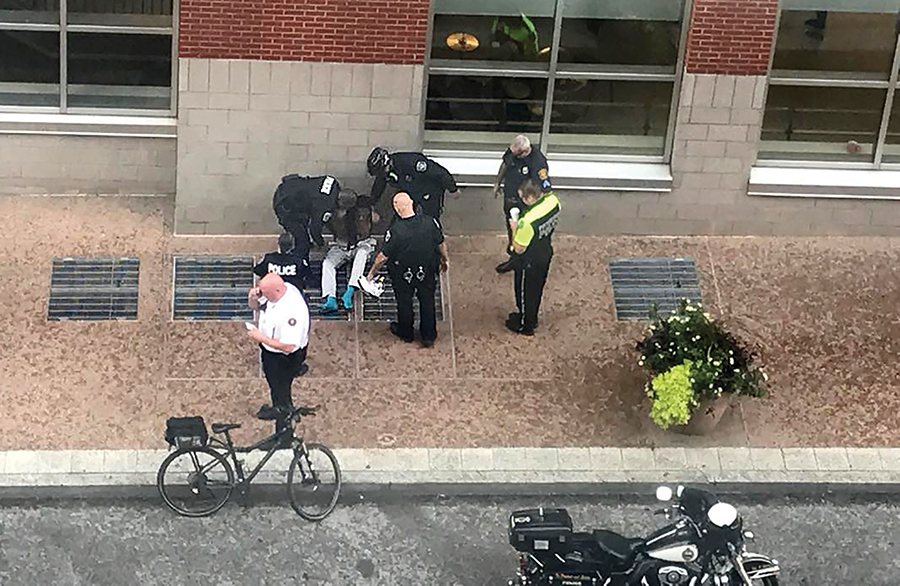 Dalbert Banks is apprehended by police outside of the George Rowland White performance space. Banks, a registered sex offender, was arrested after watching a dance class in Lawrence Hall Thursday.