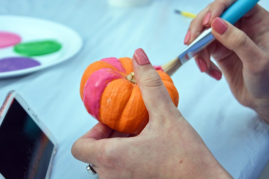 Students were given the opportunity to paint miniature pumpkins at Pumpkin Palooza in Village Park last Tuesday.