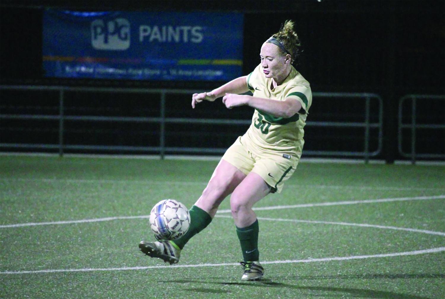 Sophomore midfielder Doreen Clark kicks the ball to a teammate on Saturday during the River States Conference Tournament Quarterfinal. The Pioneers put up two penalty kicks to OCU’s four in the final shootout.