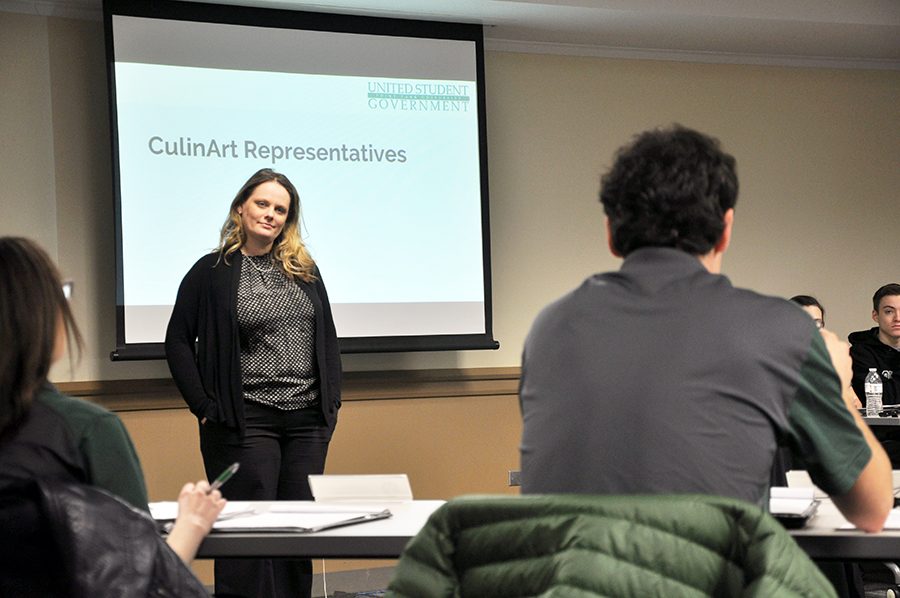 Terry Chavara, director of dining for CulinArt, listens to student concerns from Matt Bauman at Monday’s USG meeting.