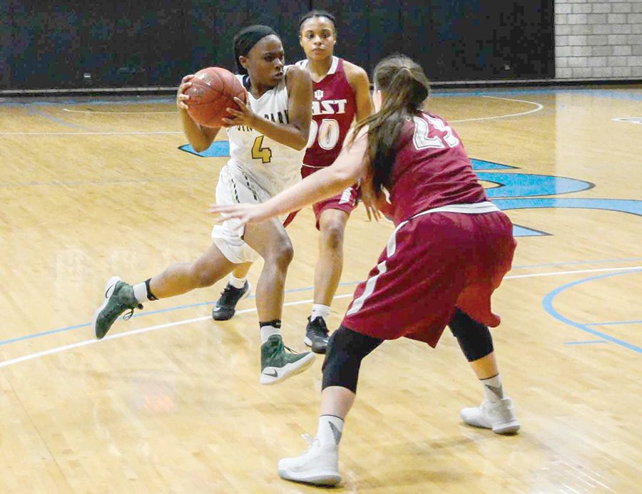 Senior guard Shaniya Rivers drives through IU East defenders in a 96-78 loss last Tuesday at CCAC Allegheny