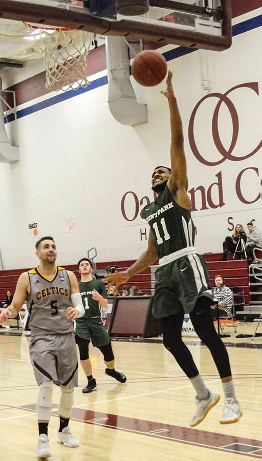 Senior guard Gavin Rajahpillay drives for a layup last week against Carlow. The Pioneers finished 4-22 after an 8-20 record last season. 