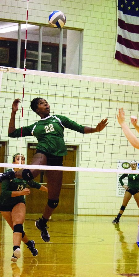Senior middle hitter Destiney Tucker attempts a spike in a 2017 matchup against Washington and Jefferson. The team won 3 conference matchups last week and are now 5-1 in conference play. 
