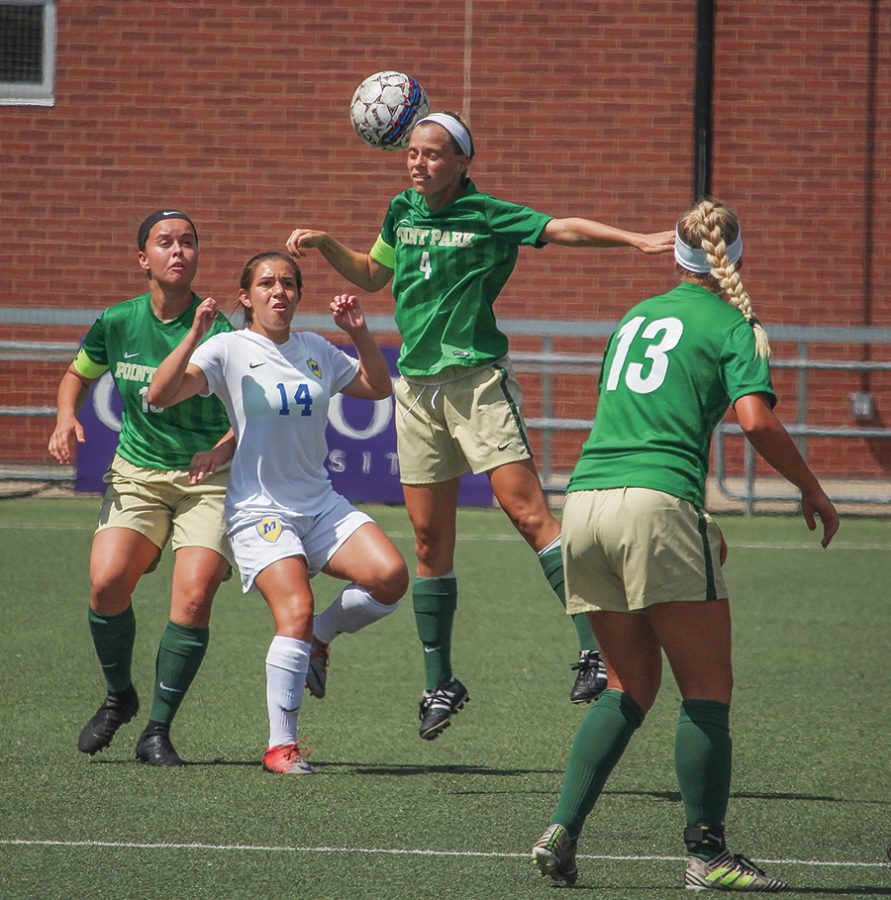 Senior defender Asia Pennock-Franke heads the ball during a match up against Lourdes University earlier this year. The team is now on a seven game win streak after defeating conference opponents Ohio Christian University and Rio Grande University this past week. 