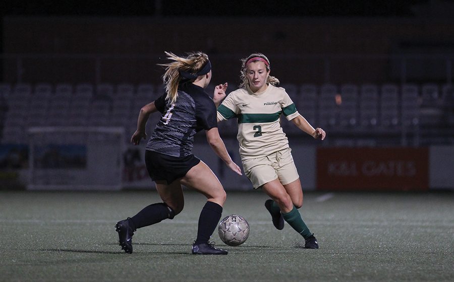 Freshman forward Tia Horew dribbles around a Carlow defender earlier this season. The Pioneers fell to Asbury University 2-0 Saturday afternoon.