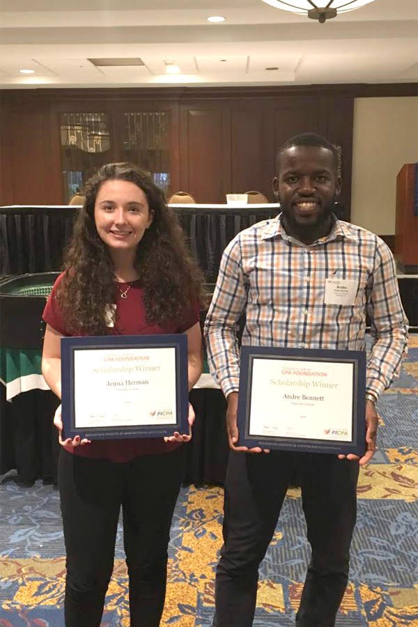 Scholarship winners Jenna Herman and Andre Bennett pose with their awards at the PICPA Casino Night on Sept. 24. 