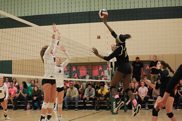 Junior middle-hitter Destiny Tucker attempts a spike against Rio Grande earlier this season. Tucker was named All-RSC Second Team last weekend.
