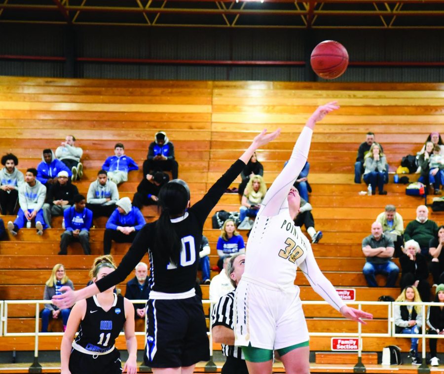 Sam Weir takes the tip off against Ohio Christian University earlier this season. The senior, who balances school, basketball and motherhood, recently scored her 1,000th point as a Pioneer and set the program record for most blocks. Weir has put up six double-doubles in the last nine games this season. 