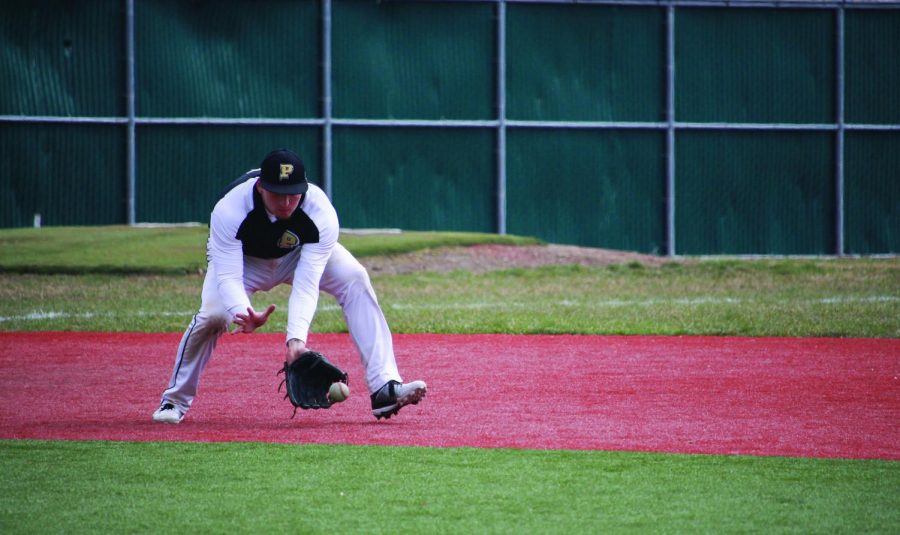 Senior third baseman Erik Montero fields a ground ball during a 2017 game. The senior is one of the few returning starters from last year’s team which won the River States Conference Championship. 