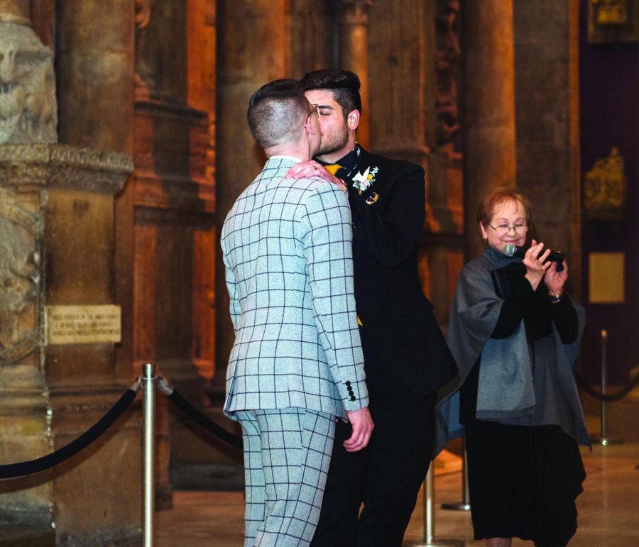 Colten Gill (left) shares a kiss with his husband, Louis Spanos (right) at their wedding on Thursday, Feb. 21. The couple, who both graduated from Point Park University, won a contest to be married at the Carnegie Museum of Art. Gill and Spanos were selected out of 73 couples who submitted their love stories to the museum in hopes of winning the free wedding.