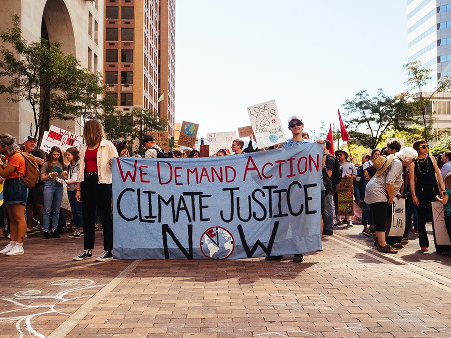 The Climate Strike marches down Grant St. in downtown Pittsburgh on Sept. 20. People of all ages participated in the Pittsburgh Climate Strike on Sept. 20 organized by The Action Network. Marchers were encouraged to wear red and black as well as bring signs. 