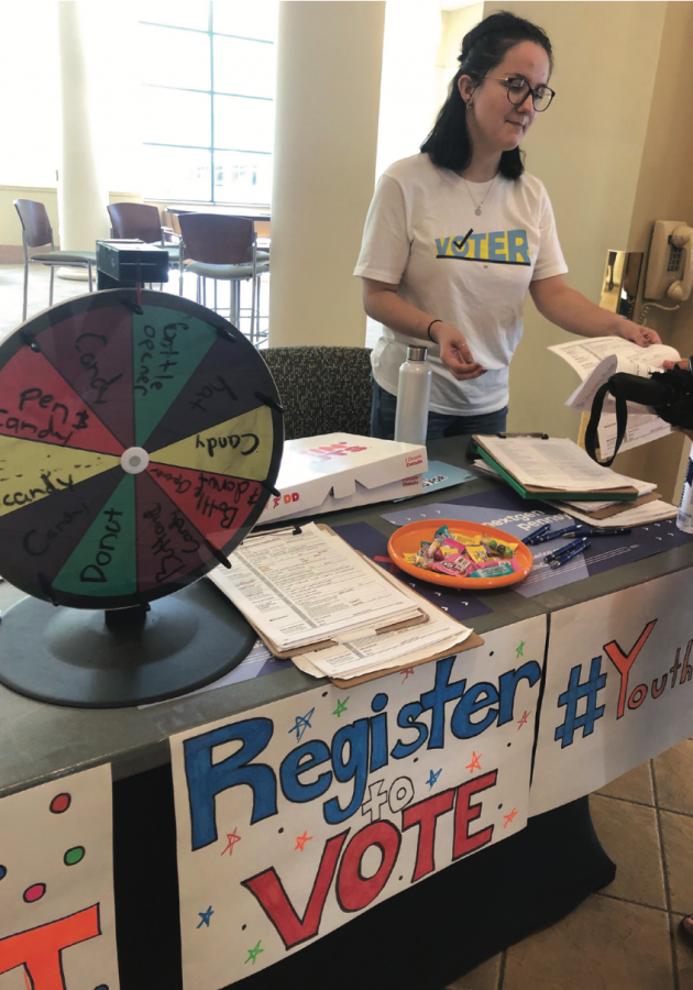 Gabby Ritterson runs NextGen America voter registration table.