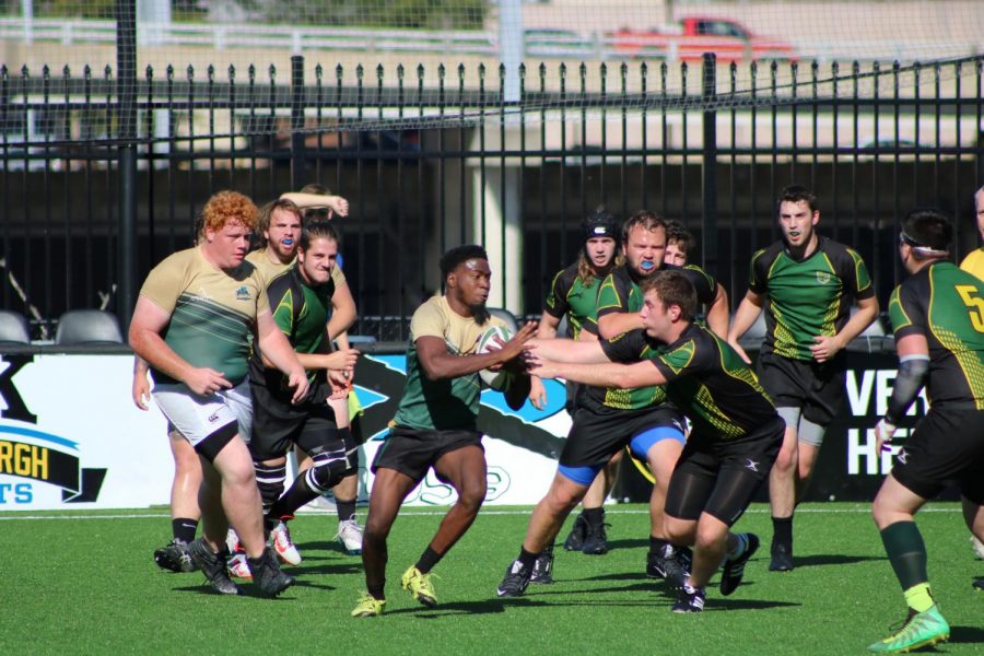 The Point Park rugby team runs the ball in one of only three games that they played this season at Highmark Stadium.
