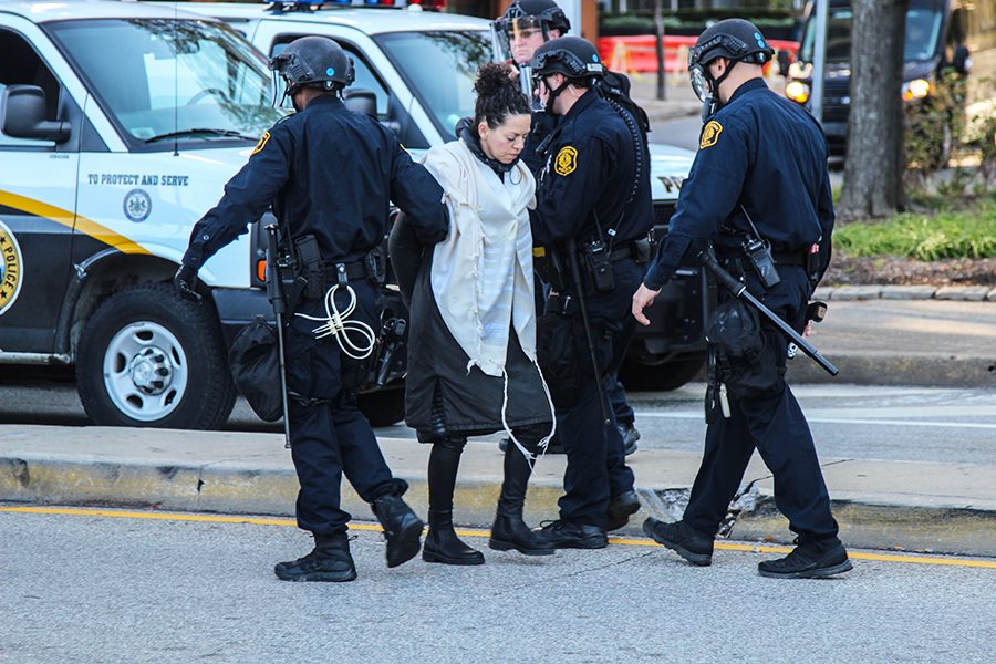 A woman is arrested during city-wide protests that occurred in response to President Trump’s visit to Pittsburgh last Wednesday, October 23.