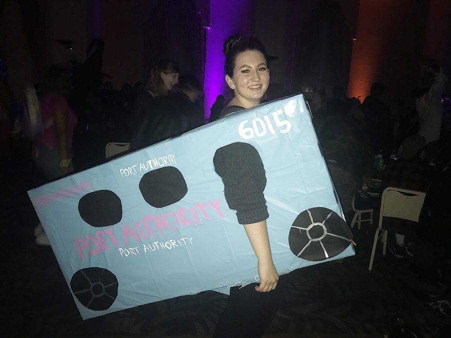 Autumn Plutt dressed at the Port Authority bus that fell into a sinkhole on Oct. 28 for Campus Activities Board’s annual Halloween Dance. The dance was held in the Lawrence Hall Ballroom.