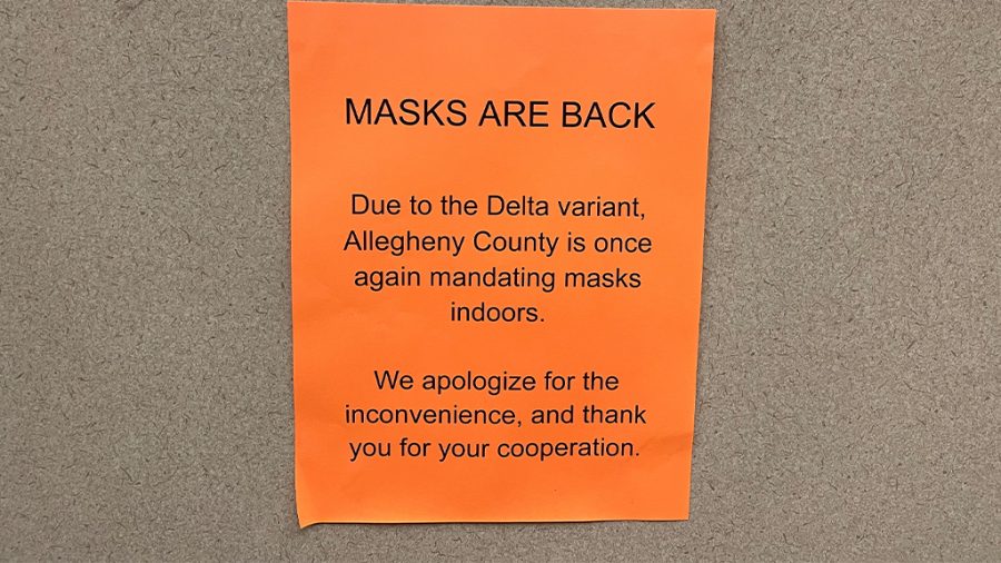 A sign in an elevator in the Student Center reminds people to wear masks amid the surge of new cases with the Delta variant. 