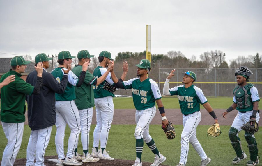 Submitted to the Globe by Joey Bova. 
Junior infielders Isaac Santana (20), Eddie Javier Jr. (21), and sophomore catcher Jordon Campbell (far right) high five their teammates after a win.  The Pioneers continue to hold first place in the River States Conference, thanks to 15-3 conference record, and have yet to drop a series to an RSC opponent this season. 