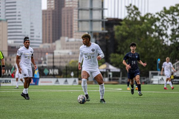 Genildo Postimo in control looking to make a pass versus Oakland City this weekend.