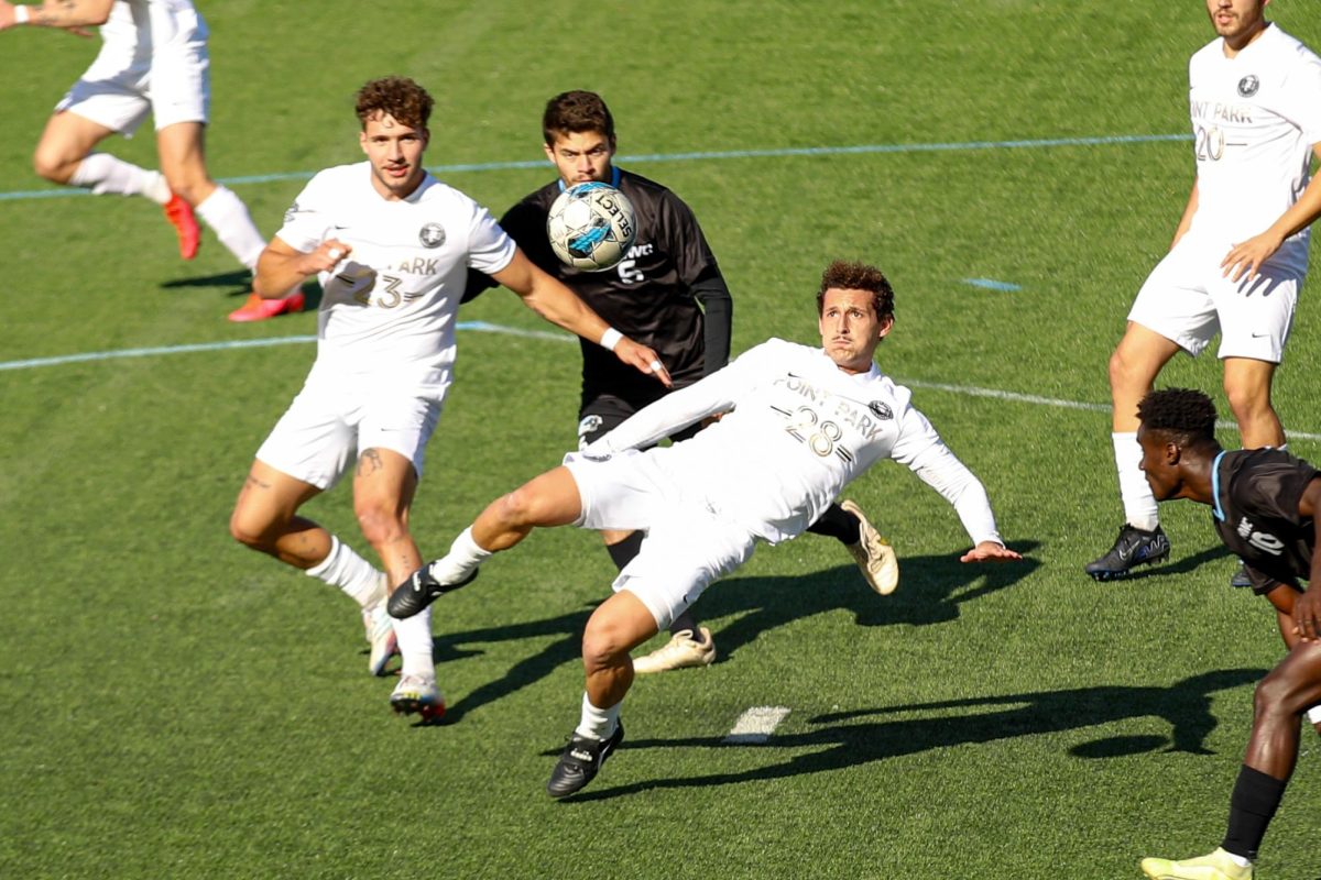 Giovanni Pezzi fights for the ball this past Saturday against St. Mary of the Woods.