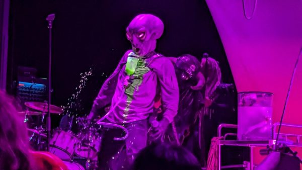 The lead singer oGhr, dressed up as an otherworldly being and covered in neon green slime, performing with Skinny puppy on November 11. 