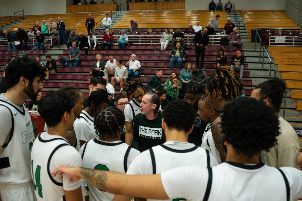Mens+Basketball+in+their+pregame+huddle+in+the+win+against+Texas+College+in+the+NAIA+national+tournament
