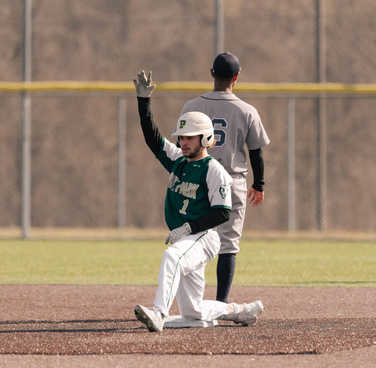 Omar Morillo celebrating a base hit in the opening day game against Fisher.