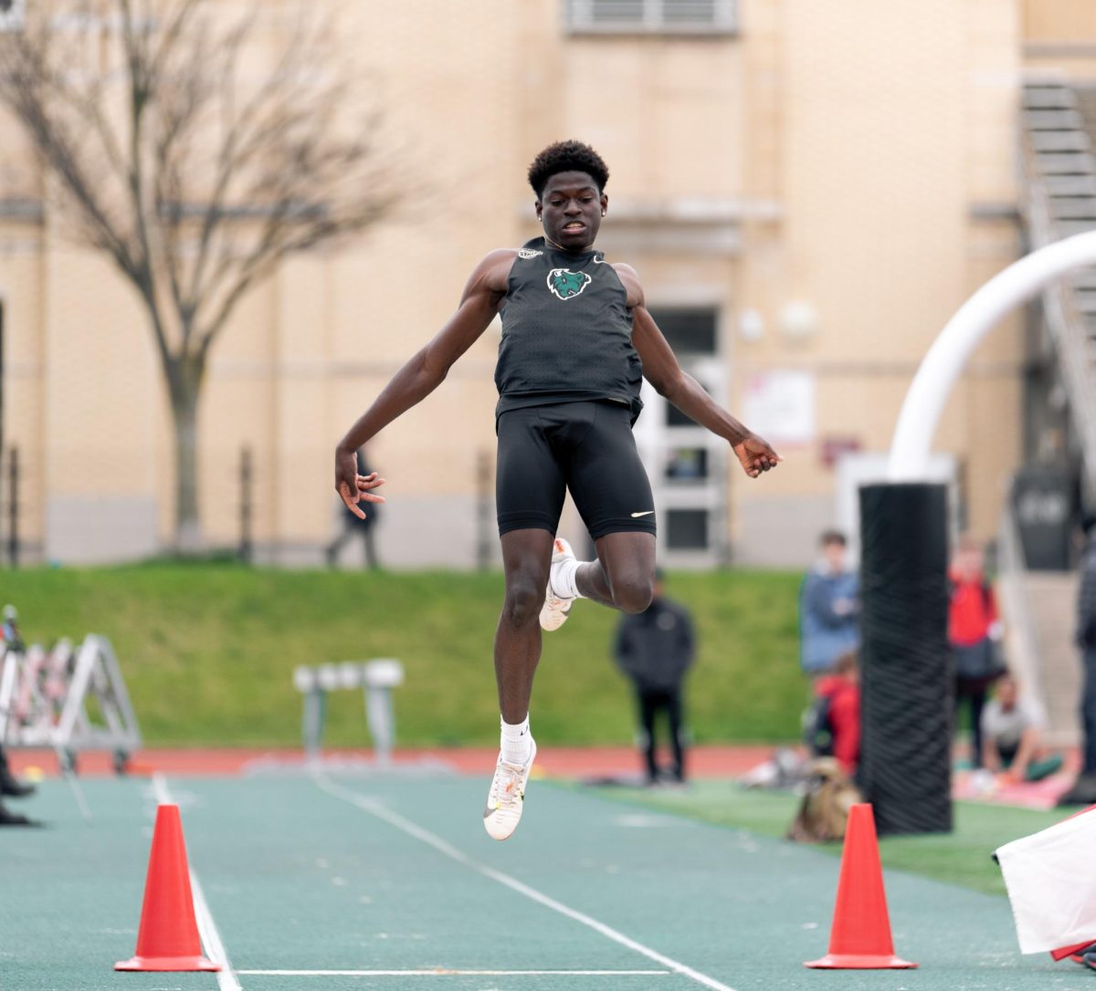 Freshman Akeem Mustapha competing in the long jump on Saturday.