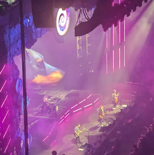 Fall Out Boy, featuring a giant dog balloon, performing at PPG Paints Arena on March 27, 2024. 