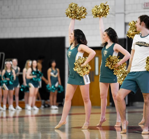 The cheer team performs during a basketball game earlier this semester.