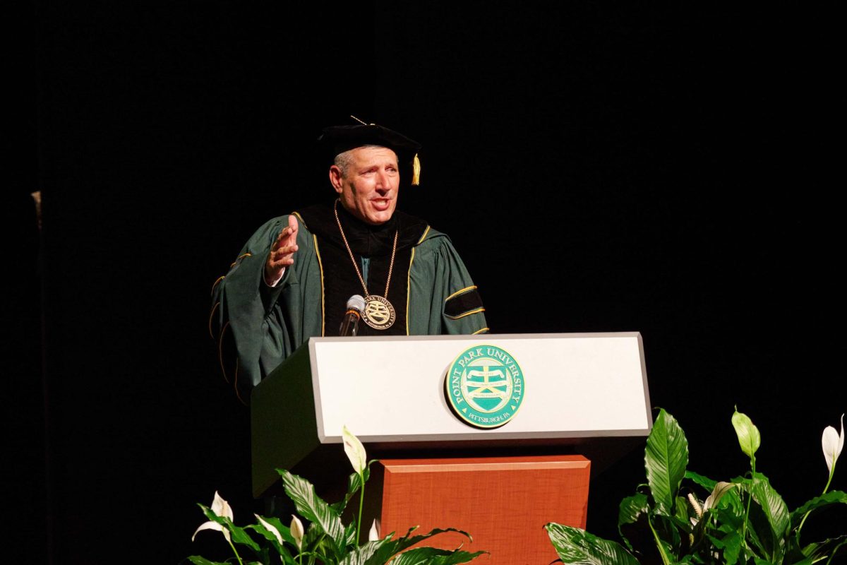 President Brussalis speaks at his own inauguration. 