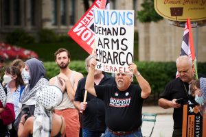 A union group representative on Pitt’s campus protests against actions taken against Gaza.