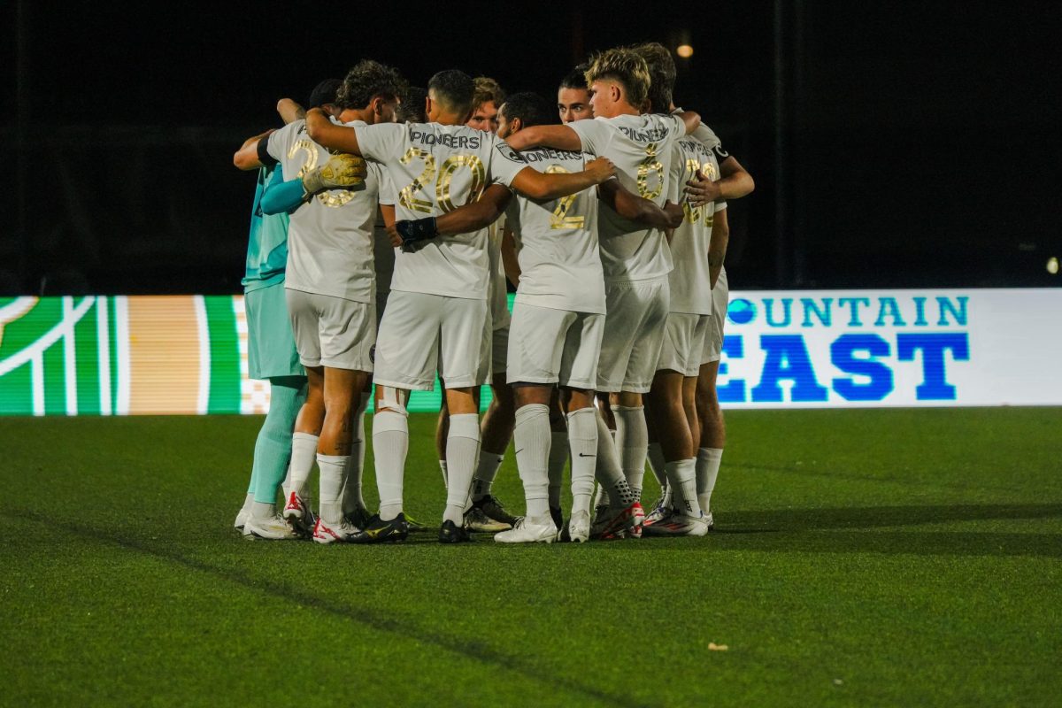 Point Park huddles before its game against West Virginia Wesleyan at Highmark Stadium in September. 