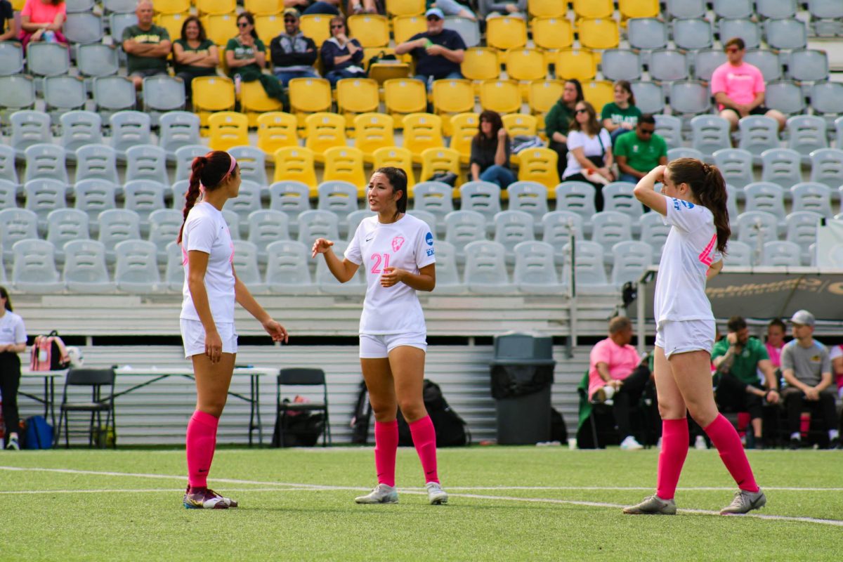 Tatum Lucero, Alina Bigger and Jamie Spurrell talk before the game.